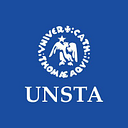 Saint Thomas Aquinus University of the North logo